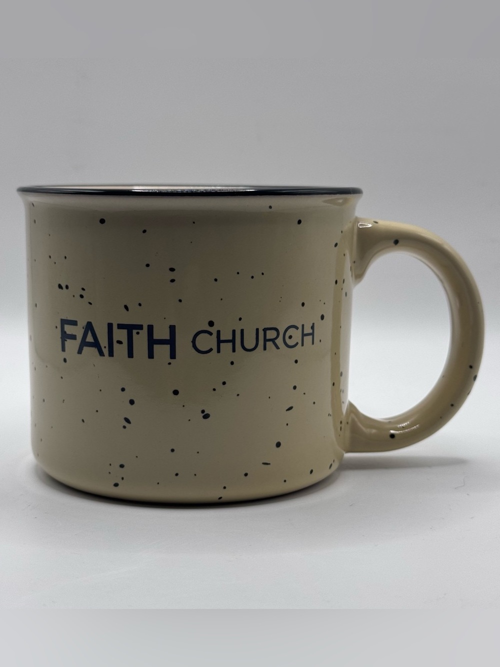 FAITH CHURCH Yellow Campfire Coffee Mug with Black Specks And Black Rim